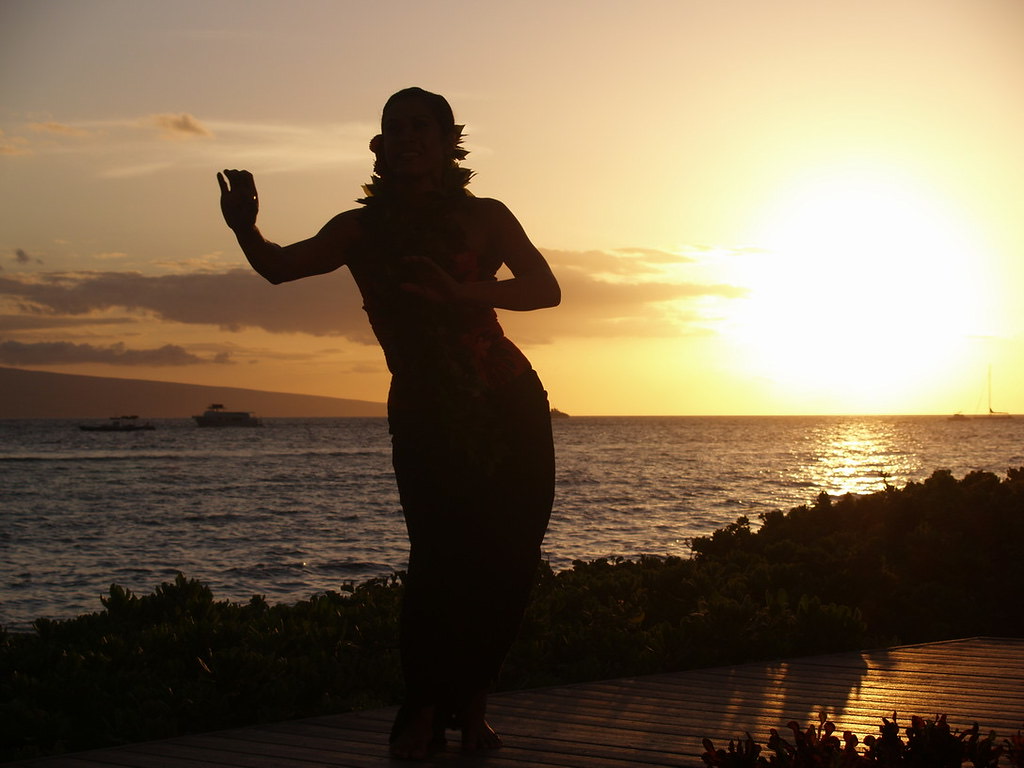 Hula danced against the ocean at sunset